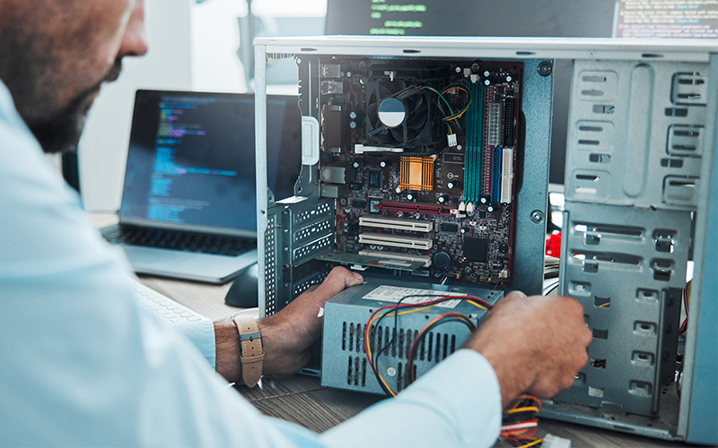 man working to fix or maintain Computer hardware and update software